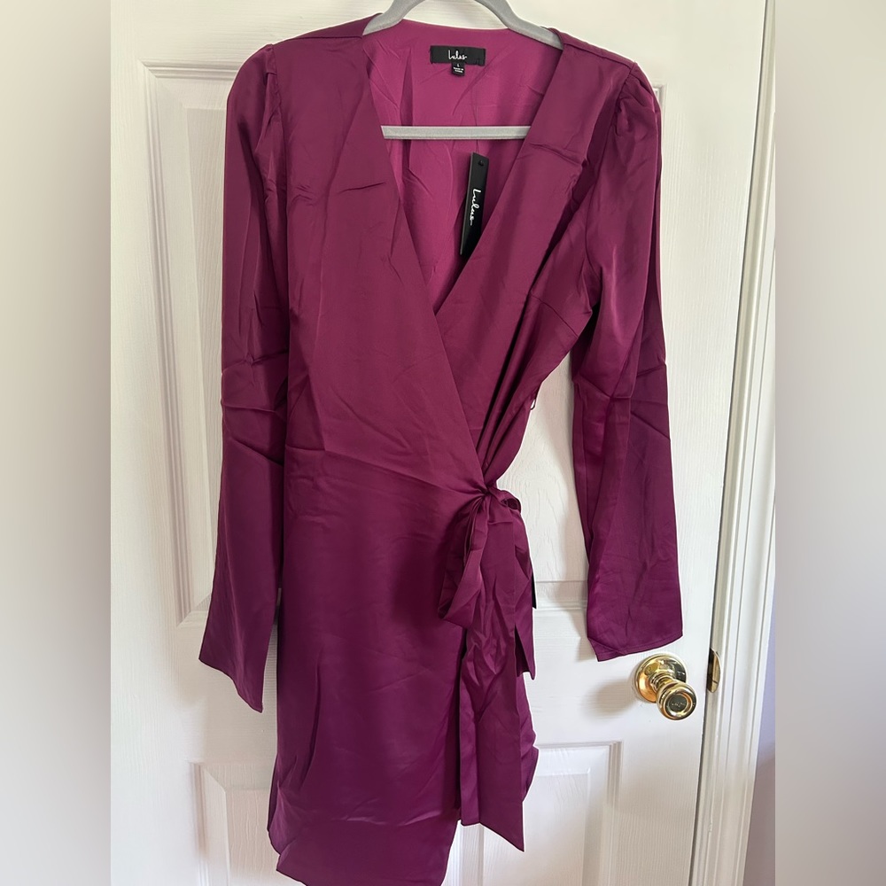 NWT Lulus plum colored wrap dress. Silky material with sleeve detail and v-neck.